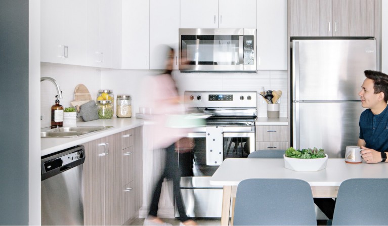 couple in a u-eight kitchen