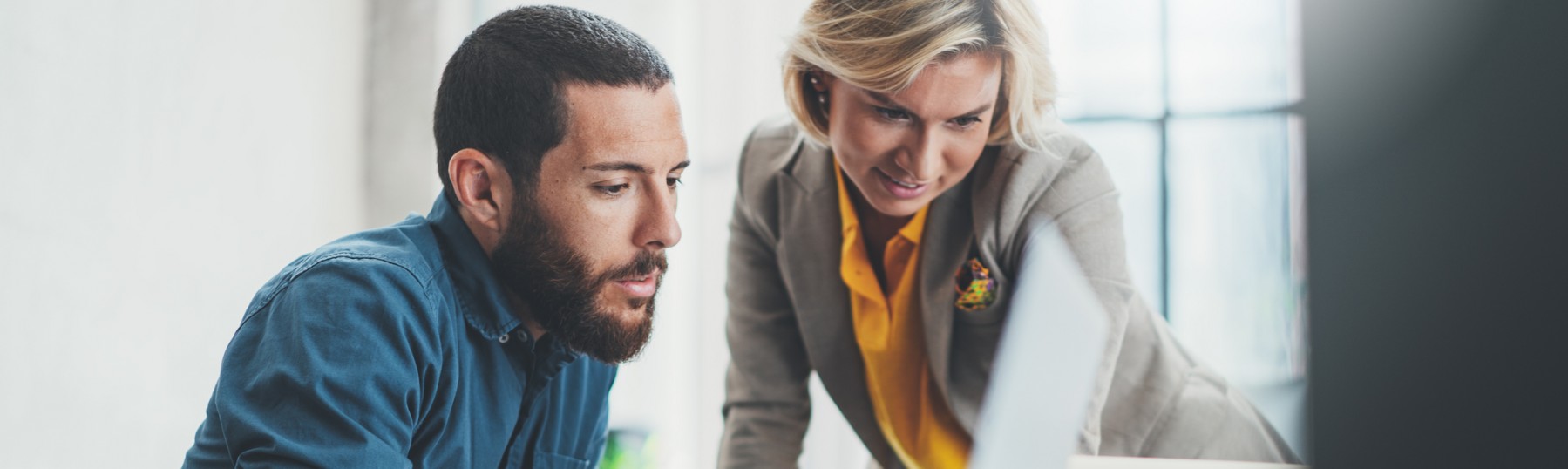 two people looking at a computer