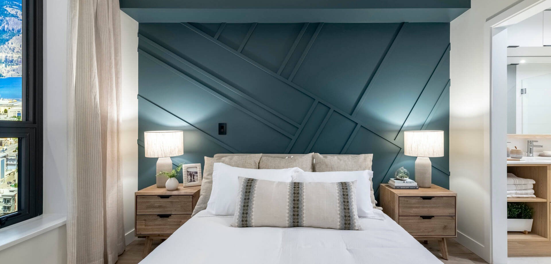 Bertram room with green wall and single plush bed.