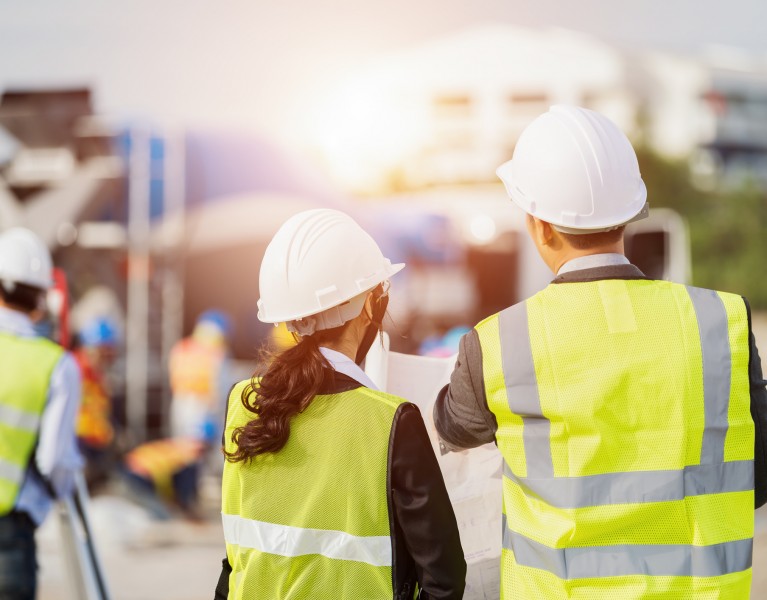 Construction Safety Officers talking on a site
