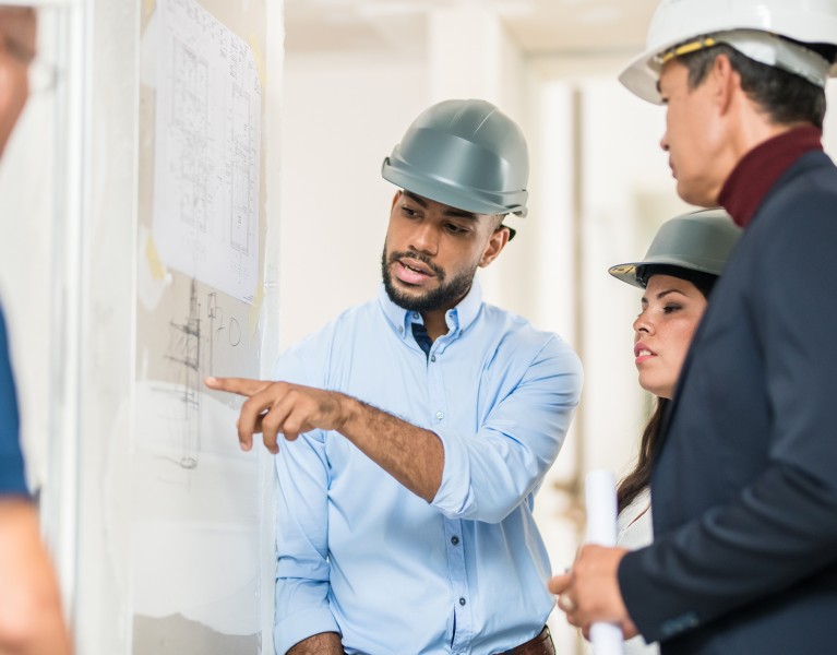 a presentation being given on a construction site