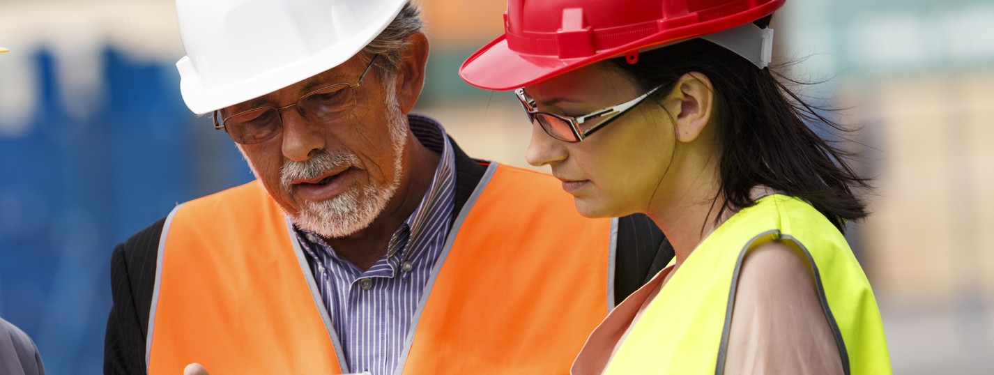 3 People reviewing building plans