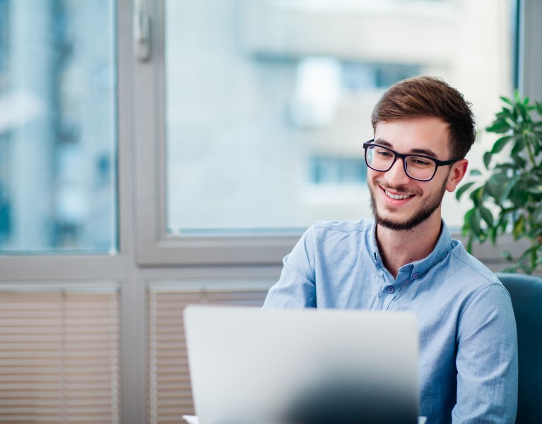 Man in an office at a computer