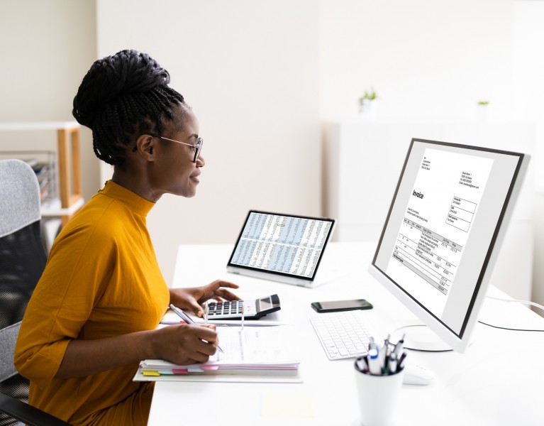 Accounting Clerk at a computer