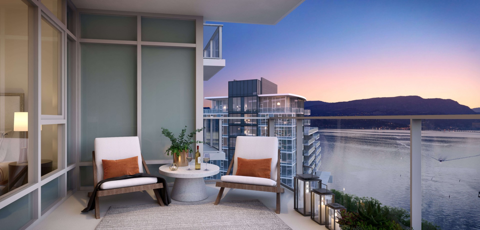 Kelowna's Waterfront Aqua penthouse balcony with a lake view